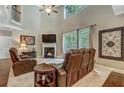 Bright living room featuring tall ceilings, fireplace, and a large window view at 1239 Side Step Trace, Lawrenceville, GA 30045
