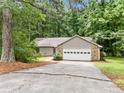 Well-maintained single-story home with an attached garage and a neatly landscaped front yard at 845 Creek Trail Northwest Nw Trl, Kennesaw, GA 30144