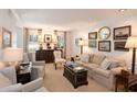 Well-appointed living room with classic furnishings, soft lighting, and elegant decor for relaxation at 40 Olde Ivy Ne Sq, Atlanta, GA 30342