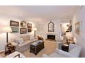 Elegant living room with neutral tones, fireplace, and stylish furnishings for comfortable living at 40 Olde Ivy Ne Sq, Atlanta, GA 30342