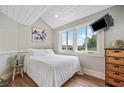 Bright bedroom with a comfortable bed, scenic views from the window, and a modern TV at 451 Wilderness Camp Rd, White, GA 30184