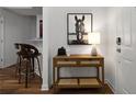 Hallway showcasing a stylish console table with decor and a striking horse art piece at 123 Ashford Cir, Atlanta, GA 30338