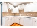 Bright kitchen with white cabinets, and sleek countertops, creating a clean and modern space at 1634 Ponce De Leon Ne Ave # 512, Atlanta, GA 30307