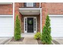 Charming front entryway with well manicured landscaping and stone accents at 215 Morris Ln, Woodstock, GA 30188