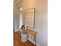 Inviting entryway featuring stylish decor, wooden floors, and a modern accent table at 101 Red Oak Ln, Carrollton, GA 30116