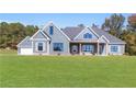 Detailed view of a modern home with gray siding and manicured lawn at 101 Red Oak Ln, Carrollton, GA 30116