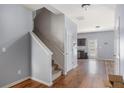 Hardwood floors in entryway with a staircase to the upper level and direct access to the kitchen area at 27 Autumn Canyon Se Path, Cartersville, GA 30121