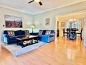 Inviting living room with hardwood floors and an open floor plan that leads to the dining area at 4638 Villa Chase Ne Dr, Marietta, GA 30068