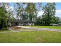 Well-maintained single-story home on a spacious lot with mature trees at 5414 Iris Sw Dr, Mableton, GA 30126