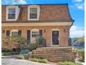 Charming home features a classic brick exterior, well-maintained landscaping, and inviting front entry at 1261 Lavista Ne Rd # E-8, Atlanta, GA 30324