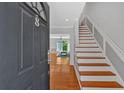 Inviting home entryway features gleaming hardwood floors and a staircase leading to the upper level at 1261 Lavista Ne Rd # E-8, Atlanta, GA 30324