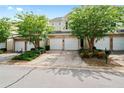 Charming townhome exterior featuring a two-car garage, landscaped front yard, and inviting curb appeal at 125 Flatwood Trail, Marietta, GA 30066