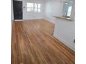 Living room features hardwood flooring, bright windows, and a granite countertop accent at 48 Peachtree Ne Ave # 321, Atlanta, GA 30305