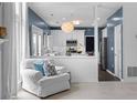 Open-concept kitchen features modern white cabinets and stainless steel appliances at 520 Weatherend Ct, Johns Creek, GA 30022