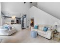 Open-concept living room and kitchen area with natural light and cozy seating at 520 Weatherend Ct, Johns Creek, GA 30022