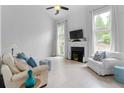 Bright living room with high ceilings, fireplace, and large windows with natural light at 520 Weatherend Ct, Johns Creek, GA 30022