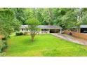 Charming single Gathering home with well-maintained lawn and mature tree coverage at 3854 Bright Star Road, Douglasville, GA 30135