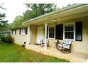 Inviting front porch with rocking chairs and charming curb appeal at 3854 Bright Star Road, Douglasville, GA 30135