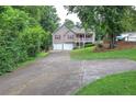 Charming home with two-car garage, covered front porch, and beautiful landscaping at 80 Broadlands Dr, White, GA 30184