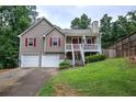 Charming home with two-car garage, covered front porch, and beautiful landscaping at 80 Broadlands Dr, White, GA 30184