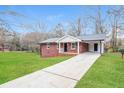 Attractive brick home with a long driveway and inviting curb appeal at 101 Longstreet Cir, Oxford, GA 30054