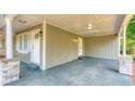 A concrete carport with stone pillars and space for a car at 2279 Hickory Grove Nw Rd, Acworth, GA 30101
