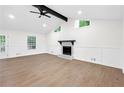 Bright living room with modern fireplace and beautiful hardwood floors at 630 Pennylake Ct, Stone Mountain, GA 30087