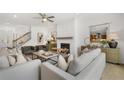 Cozy living room with a white brick fireplace, shiplap accents, and comfortable seating arrangement at 4317 Azalea Ridge Way, Hoschton, GA 30548