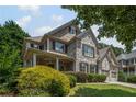 Lovely home with a welcoming covered porch and a well-maintained lawn at 4120 Abingdon, Cumming, GA 30041