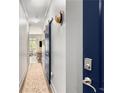 Hallway with hardwood floors and an indigo barn door at 1055 Piedmont Ne Ave # 106, Atlanta, GA 30309