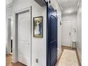 Hallway featuring hardwood floors and two entry ways at 1055 Piedmont Ne Ave # 106, Atlanta, GA 30309