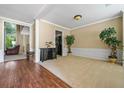 Bright living room featuring hardwood floors and neutral carpeting at 496 Bottesford Nw Dr, Kennesaw, GA 30144