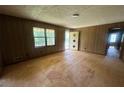 Empty bedroom with unfinished floor and views to the exterior at 9160 Carr Cir, Covington, GA 30014