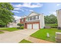Charming two-story home with a brick facade, two-car garage, and well-maintained landscaping at 2011 Wildcat Lake Ct, Lawrenceville, GA 30043