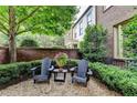 Relaxing front yard sitting area with Adirondack chairs and lush greenery, perfect for outdoor enjoyment at 3163 Neal Ct, Cumming, GA 30041