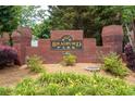 Brick sign for Bradford Park community surrounded by vibrant landscaping, offering a welcoming entrance at 3554 Cherry Blossom Court, Loganville, GA 30052