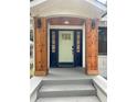 The entry way features beautiful wood accents and a freshly painted front door at 1460 Hartford Sw Ave, Atlanta, GA 30310