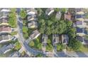 An aerial view of a suburban neighborhood with tree-lined streets and various residential homes at 4350 Annlette Dr, Lawrenceville, GA 30044