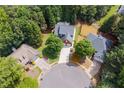 Aerial view of residences showcasing mature trees and landscaping in a peaceful community at 13995 Mariners Cv, Alpharetta, GA 30005