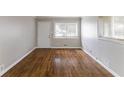 A spacious living room with hardwood floors, neutral walls, and abundant natural light at 1561 Rupert Rd, Decatur, GA 30032