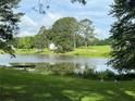 Beautiful view of the pond and wooded land at 3657 Linda Dr, Loganville, GA 30052