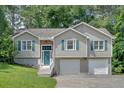 Charming two-story home with a two car garage and nicely manicured lawn at 323 Bells Ferry Ne Rd, White, GA 30184