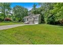 Charming two-story home with a two car garage and nicely manicured lawn at 323 Bells Ferry Ne Rd, White, GA 30184