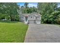 Charming two-story home with a two car garage and nicely manicured lawn at 323 Bells Ferry Ne Rd, White, GA 30184