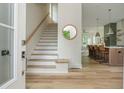 Entryway with staircase, wood flooring, and view into kitchen at 38 Mildred Nw Pl, Atlanta, GA 30318