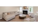 Comfortable living room features neutral tones, fireplace, and plenty of natural light at 1574 Glenfield Dr, Lawrenceville, GA 30043