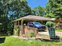 Features a multi-car driveway, mature trees, and a well-maintained lawn at 965 Stokeswood Se Ave, Atlanta, GA 30316