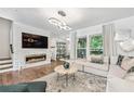 Stylish living room with a modern fireplace, sleek lighting, and a comfortable, contemporary design at 1049 Brandsford Nw St # 27-01, Atlanta, GA 30318