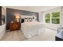 Relaxing main bedroom featuring a serene color palette and large windows at 7223 Lacey Lot 146 Dr, Douglasville, GA 30134