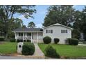 Lovely home with a welcoming front porch, tidy landscaping, and a well-maintained lawn at 3835 Clearwater Dr, Atlanta, GA 30349
